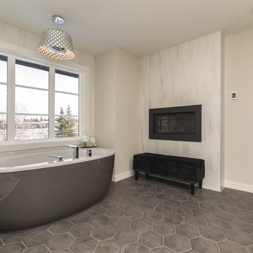 A beautiful shot of a modern house bathroom with technology and art